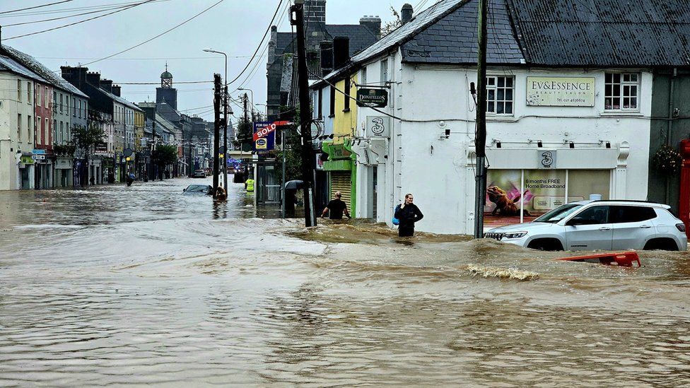 Floodwater through a street in Midleton, County Cork