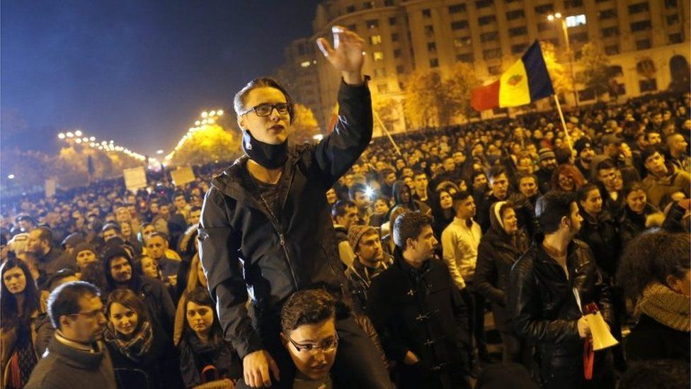 A Romanian young man shouts anti-government slogans during a rally in reaction to the nightclub fire accident in front of Parliament House in Bucharest, Romania, 4 November 2015