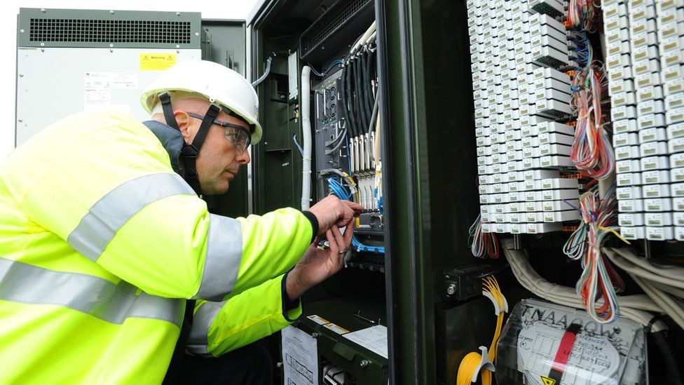 Engineer working on broadband connections
