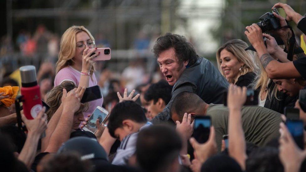 Argentine presidential candidate Javier Milei greets his supporters during a campaign event at the National Flag Monument in Rosario, Argentina, 14 November 2023.