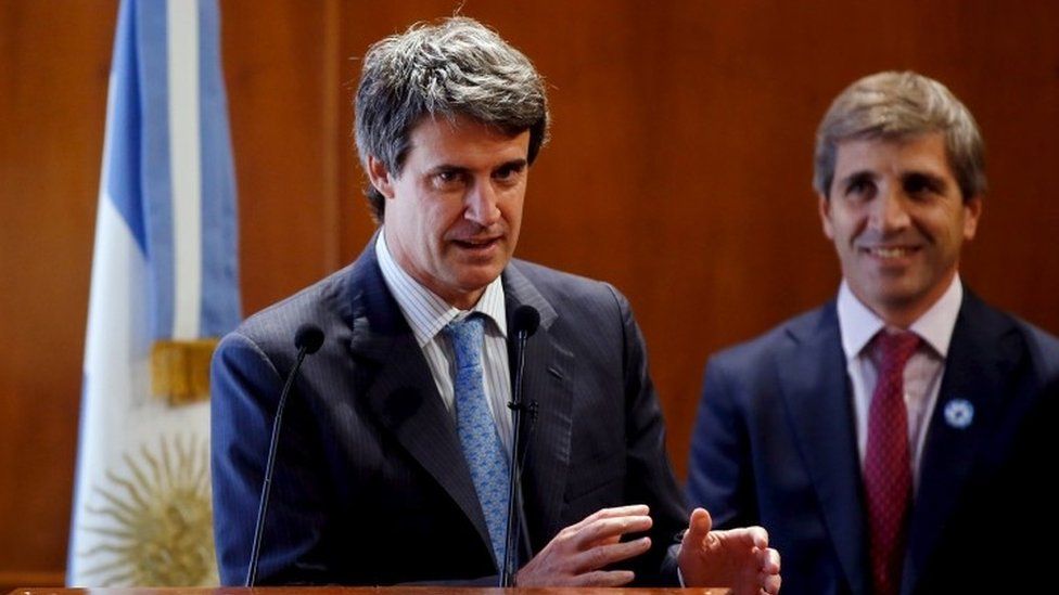 Argentina"s Finance Minister Alfonso Prat-Gay (L) speaks next to Finance Secretary Luis Caputo during the presentation of the Finance Ministry team in Buenos Aires, Argentina, December 11, 2015.