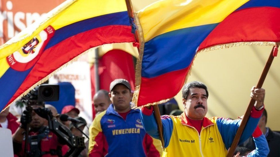 Nicolas Maduro waved the flags of Colombia and Venezuela during a rally in Caracas