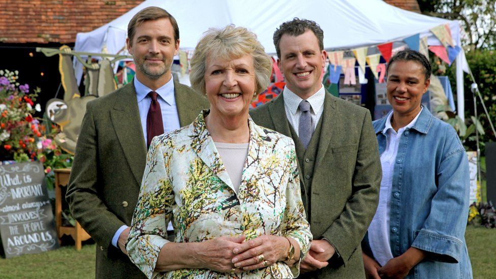 Penelope Keith (centre) presents the Village of the Year series