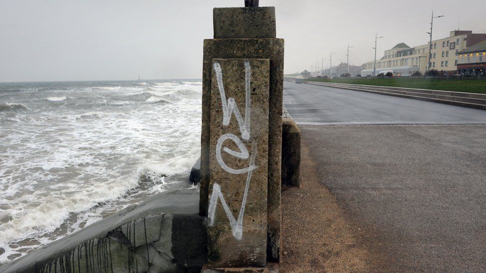 Graffiti on a seafront wall