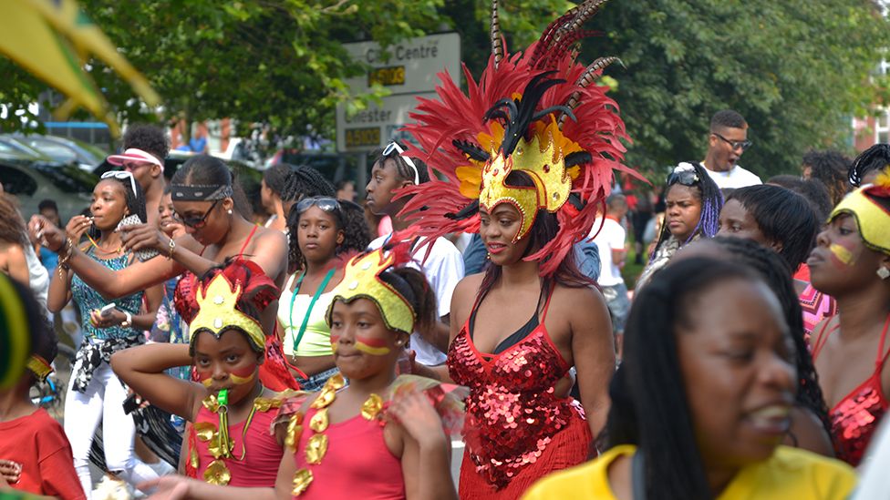 People dressed up for the Manchester Carnival