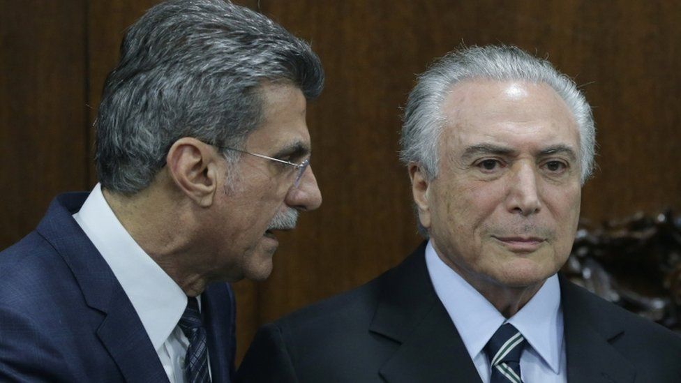 Brazil's acting President Michel Temer, right, talks with Planning Minister Romero Juca (23 May)