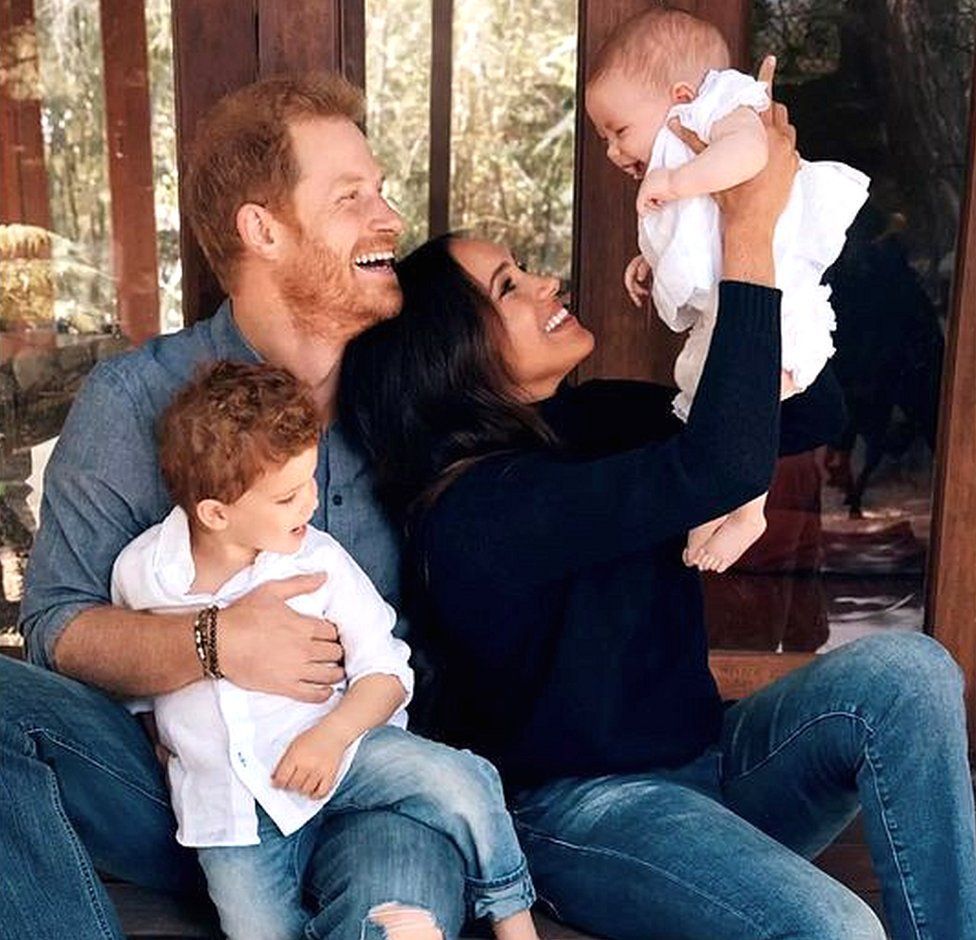 Image from 2021 holiday card from Duke and Duchess of Sussex showing the couple with their children Archie and Lilibet