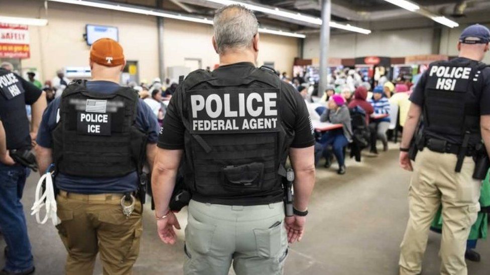 US Immigration and Customs Enforcement (ICE) agents stood at a detention centre