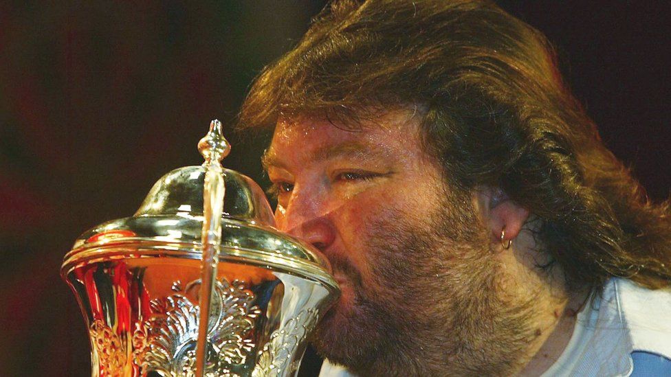 Andy Fordham kisses the trophy after winning The BDO Lakeside World Darts Championships in January 2004