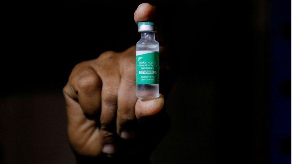 A man displays a vial AstraZeneca"s COVISHIELD vaccine as the country receives its first batch of coronavirus disease (COVID-19) vaccines under COVAX scheme, in Accra, Ghana