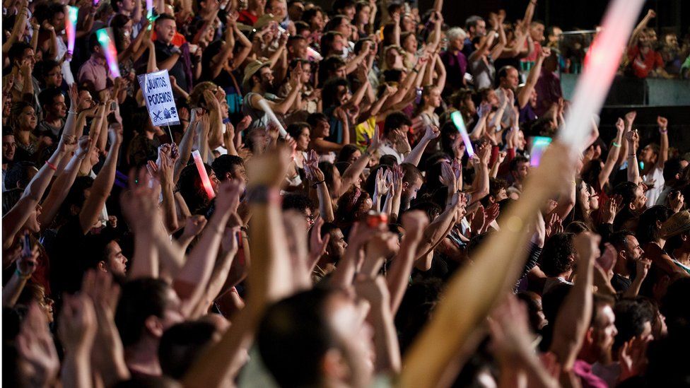 Unidos Podemos (United We Can) supporters cheer as their leader Pablo Iglesias speaks on stage after the elections results on 26 June 2016 in Madrid, Spain.