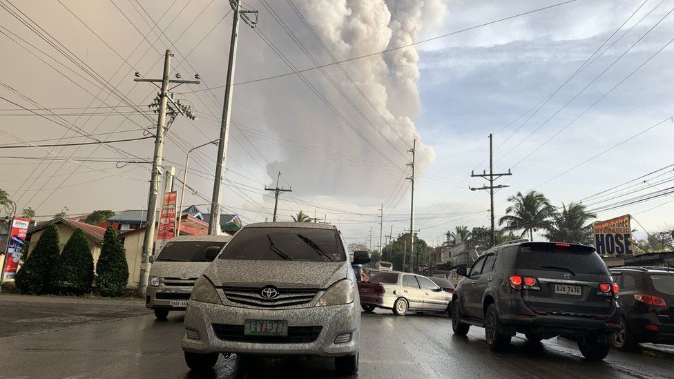 An ash column from Taal volcano looms over Tagaytay city, Philippines, 12 January 2020.