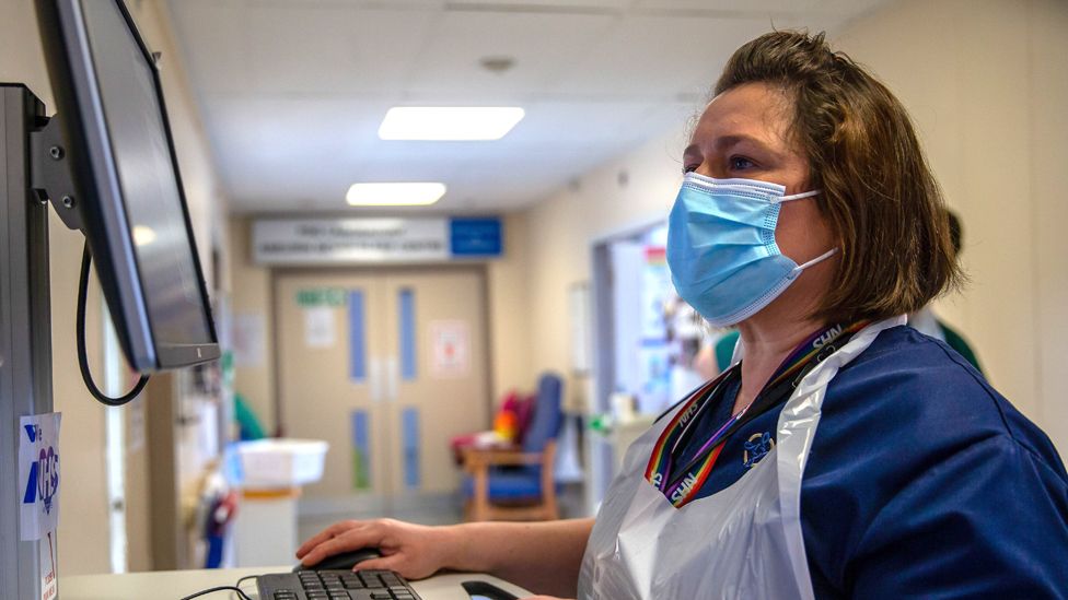 Sister Helen Golding checks patient records on a computer at Nevill Hospital on March 08, 2021 in Abergavenny, Wales.