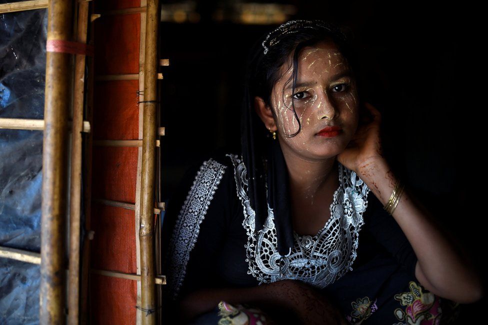 Rohingya refugee Juhara Begum, aged 13, poses for a photograph as she wears thanaka paste at Jamtoli camp in Cox's Bazaar, Bangladesh