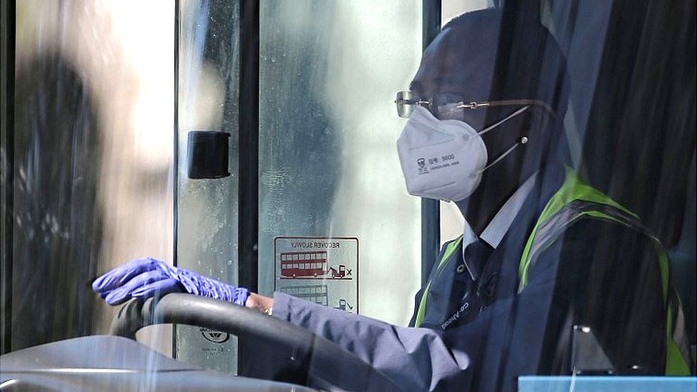 Bus driver with face mask