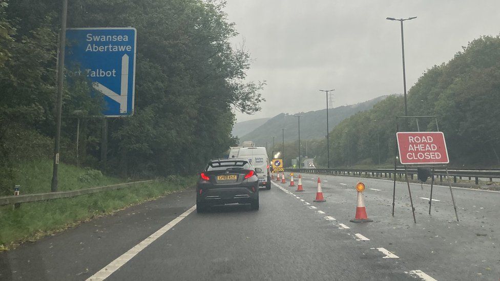 Queueing traffic and a road closed sign at junction 38 of the M4