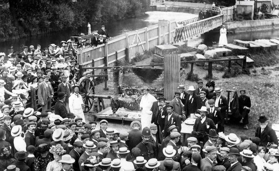 Crowd gathered for an ox-roast near to the River Thames, Osney Bridge, Oxfordshire, June 1887; in celebration of Queen Victoria's Jubilee