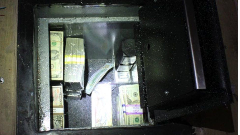 Underfloor safe with cash inside