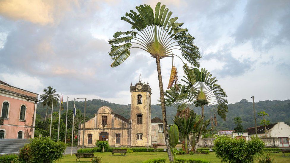 Palm trees in the Marcelo da Veiga square next to the church of Santo Antonio, Sao Tome