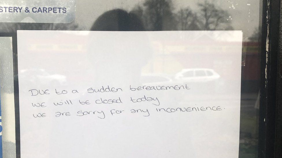 A sign on the window of the dry cleaners in Hassocks