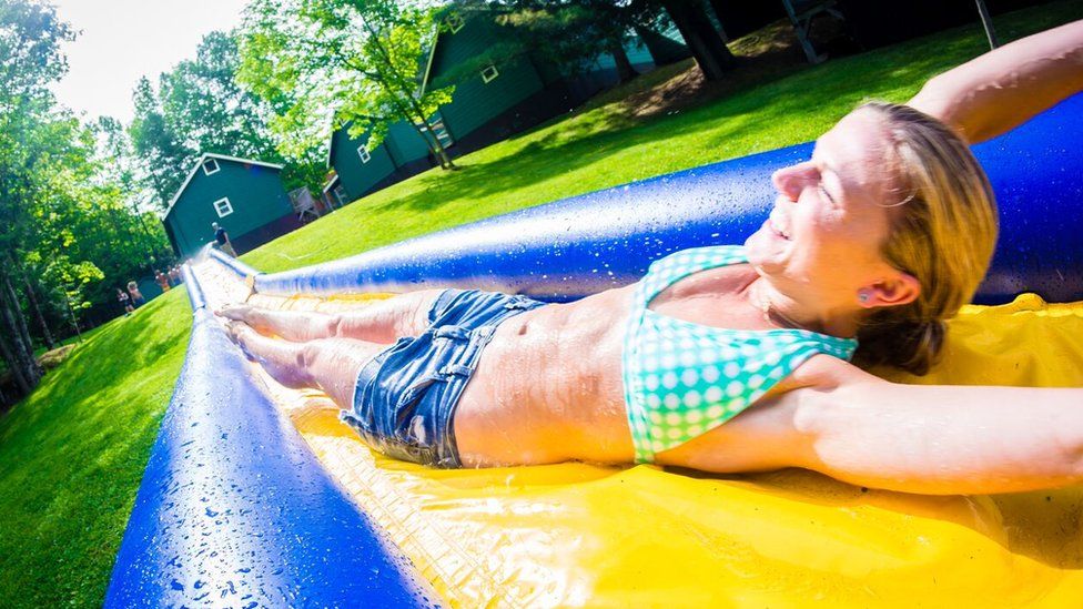 Woman on a water slide