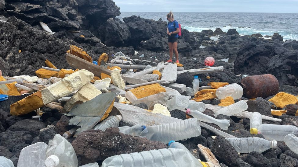 Close shot of plastic debris on beach.
