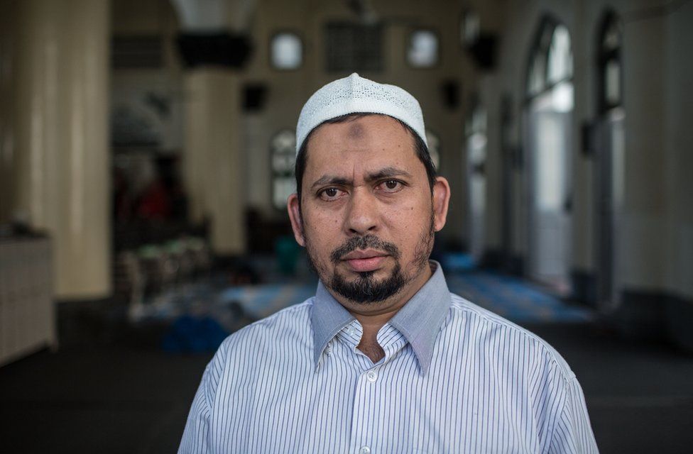 Farooq poses for a portrait in the Mughal Shia Mosque in downtown Yangon, November 19, 2015.
