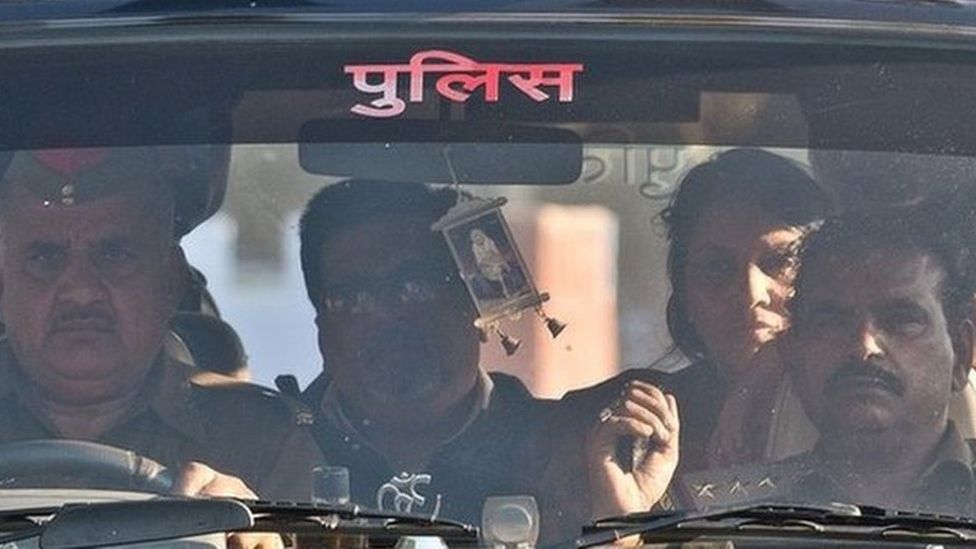 Rajesh Talwar (second from left) and his wife Nupur Talwar (second from right) arrive at a prison in India in 25 November 2013