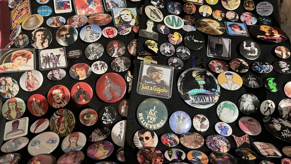 Collection of David Bowie pin badges on display at museum