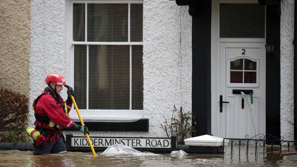 Personnel from the Severn Area Rescue Association (SARA) wade done  flood h2o  successful  Bewdley to cheque  connected  the payment   of residents aft  the River Severn breached defences connected  February 23, 2022 successful  Bewdley, Worcestershire.