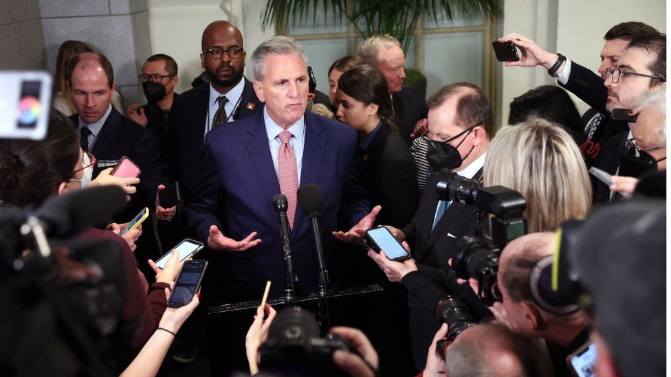 Kevin McCarthy surrounded by reporters