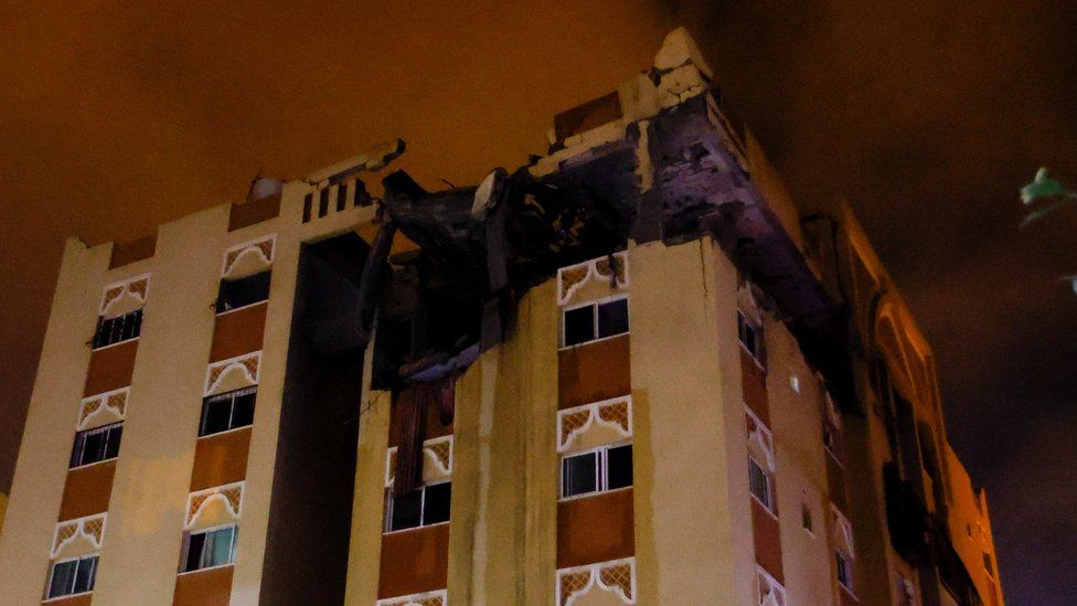 A building hit during an Israeli strike is seen in Khan Younis in the southern Gaza Strip, May 11, 2023