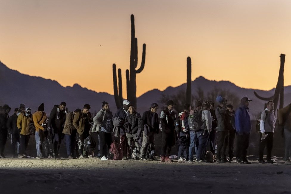 Queue of migrants outside processing centre in Arizona after crossing the border