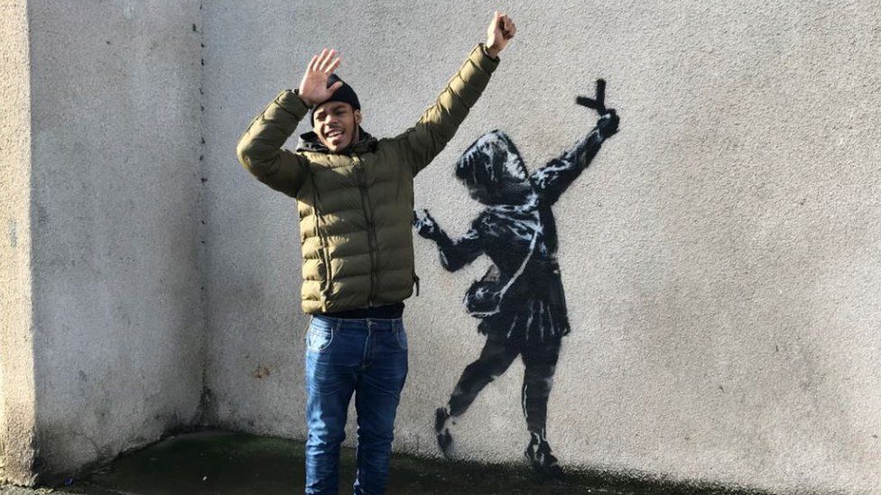 Banksy fan Remel Sewell believes the message may be to celebrate love and peace