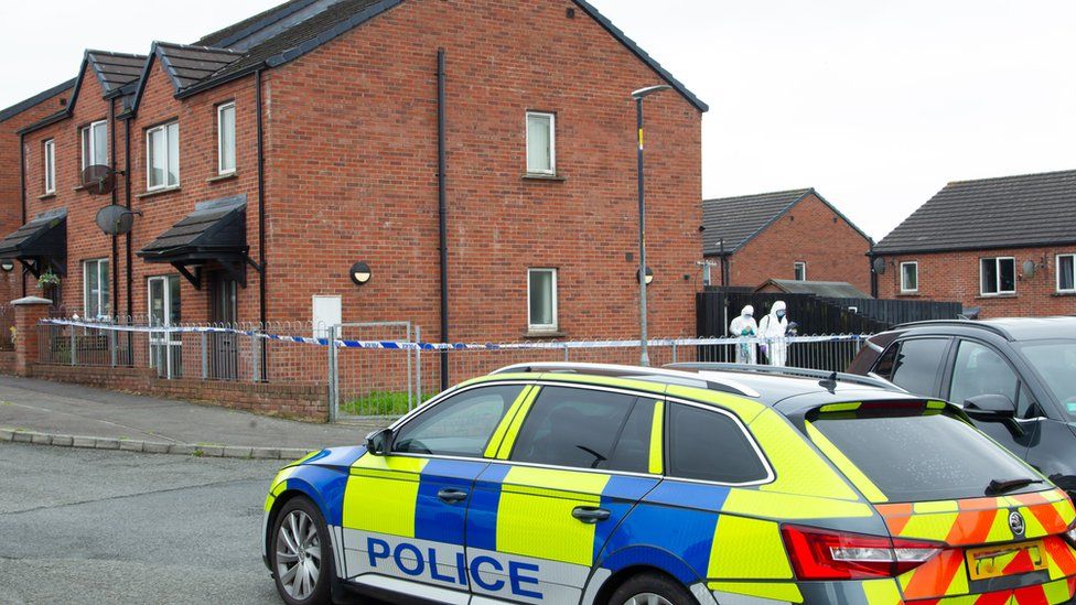 Police car in front of a house