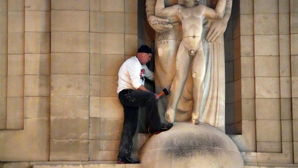 A man attacks the Prospero and Ariel statue outside Broadcasting House