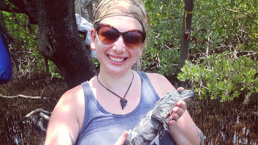 Daisy Maryon with iguana