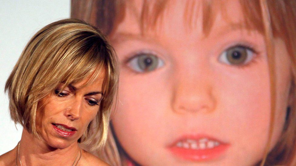 Kate McCann in front of a photo of Madeleine