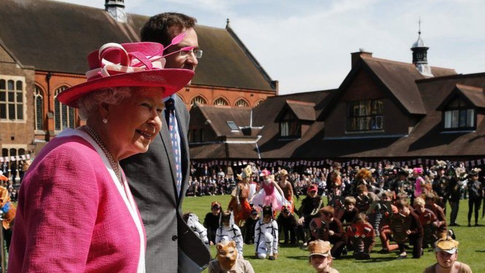 The Queen and Berkhamsted School Principle, Richard Backhouse watching a performance of The Lion King during her visit to Berkhamsted School on May 6, 2016