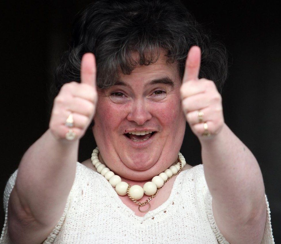 Susan Boyle giving the thumbs up at her Blackburn home