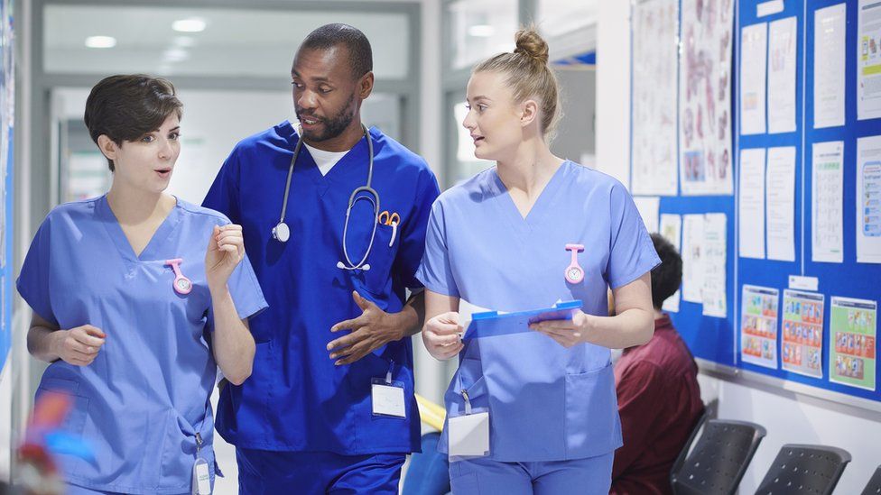Stock photo of a consultant and two nurses in a hospital