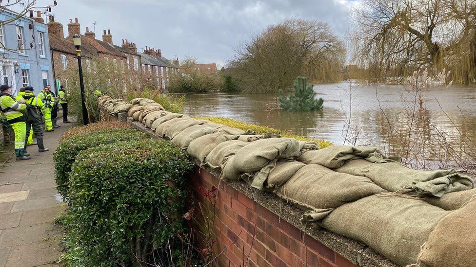 Sandbags on top of river defences in Cawood
