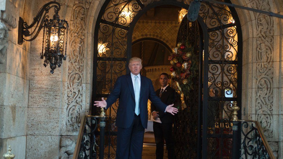 Trump - standing in front of his Mar-a-Lago estate