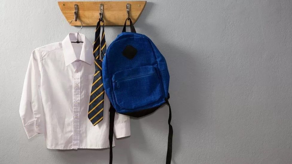 School shirt tie and rucksack hanging up