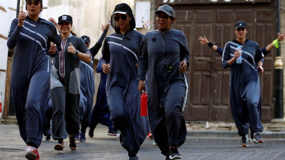 Women run during an event marking International Women's Day in Old Jeddah, Saudi Arabia on 8 March 2018