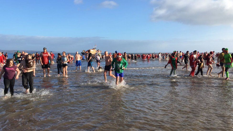 Tenby Boxing Day swimmers in the sea