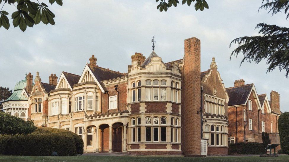 An external view of Bletchley Park, an elaborate British country house made of red brick with fine external decorative work