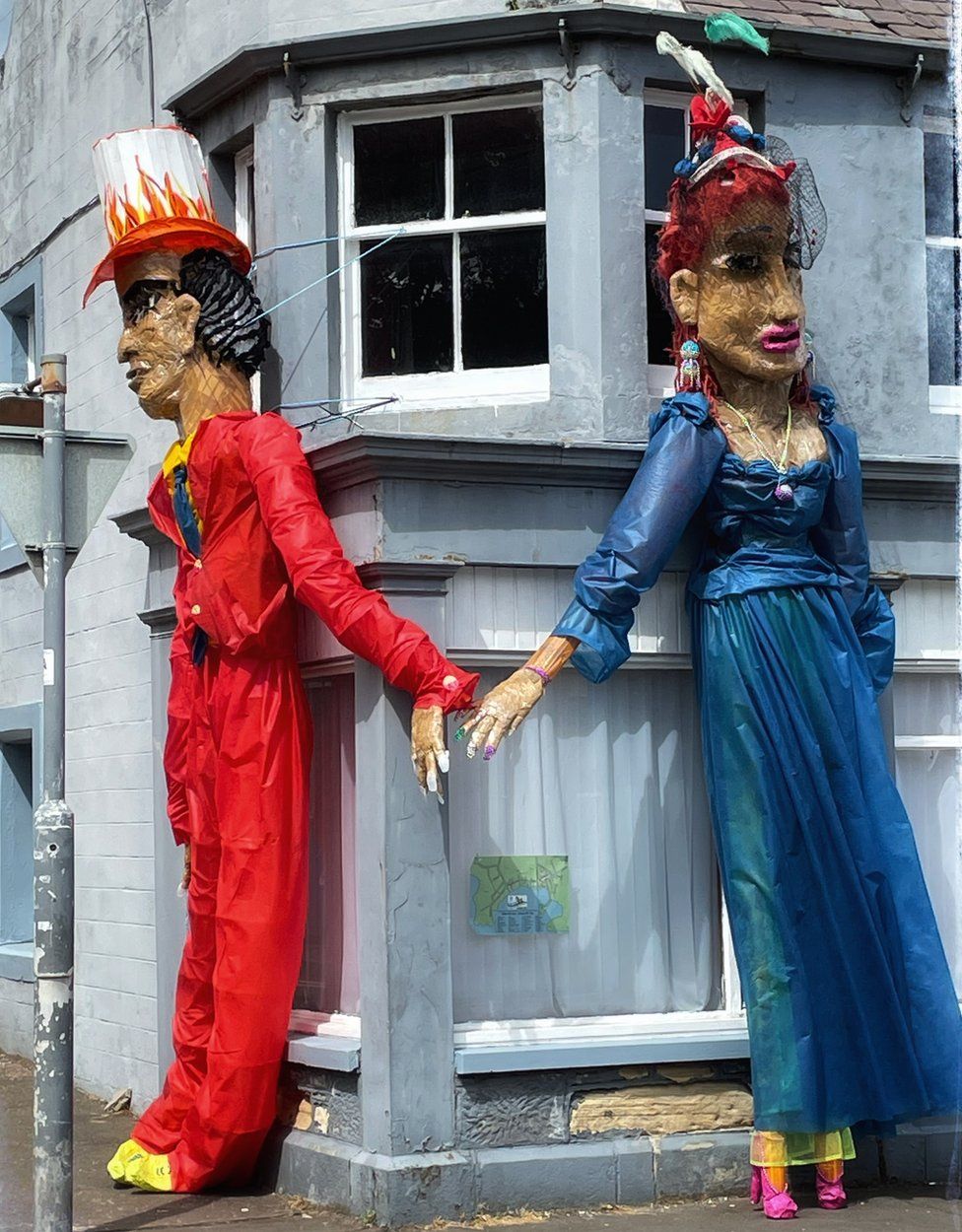 Scarecrows on street