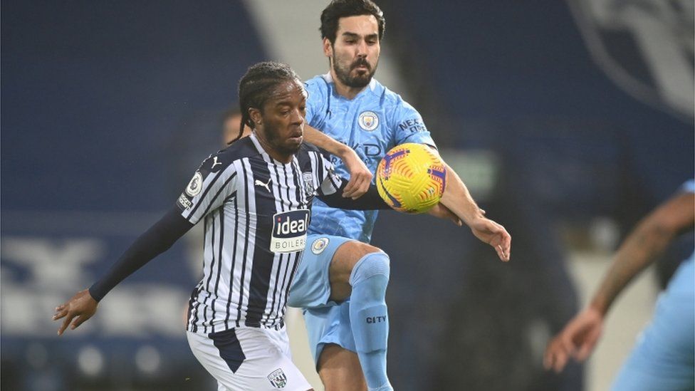 West Bromwich Albion"s Romaine Sawyers in action against Manchester City