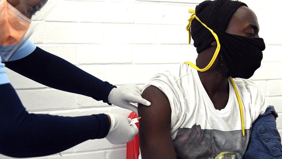A volunteer receives an injection from a medical worker during the country's first human clinical trial for a potential vaccine against COVID-19 at the Baragwanath Hospital on June 28, 2020 in Soweto, South Africa.